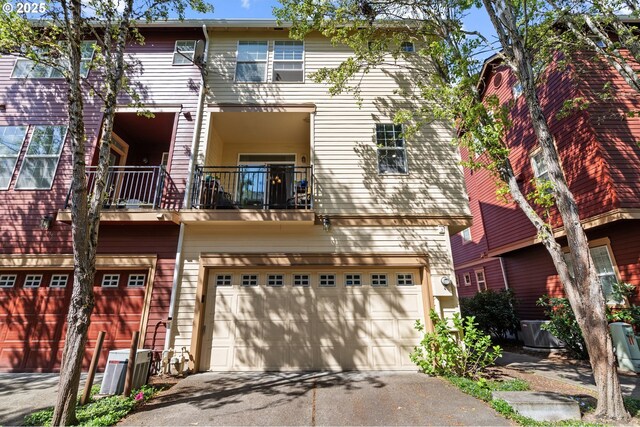 842 NE Rothbury Ave, Hillsboro, OR 97124 - exterior space with an attached garage, driveway, and a balcony