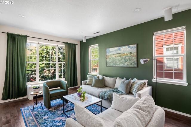 842 NE Rothbury Ave, Hillsboro, OR 97124 - living room featuring baseboards, wood finished floors, visible vents, and recessed lighting