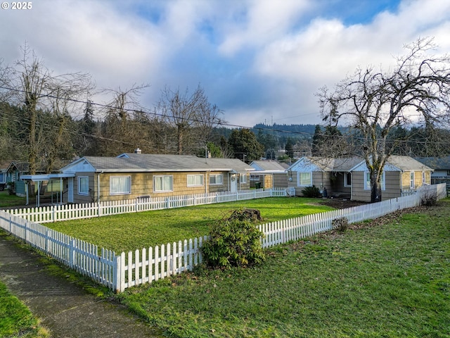 single story home with a front lawn