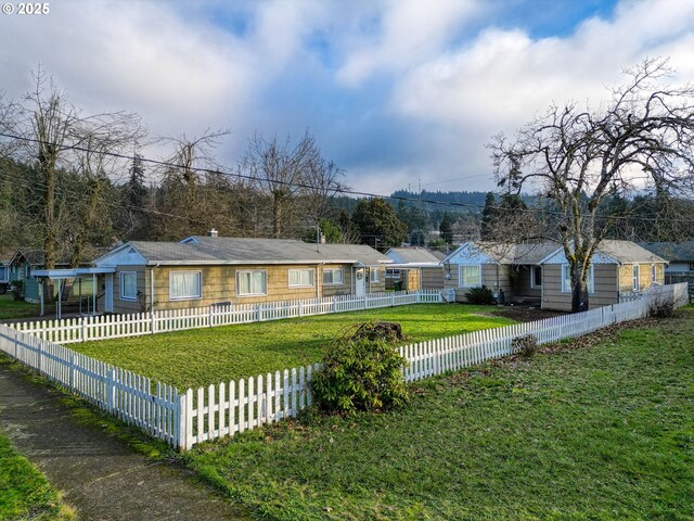 bungalow-style home with a front lawn