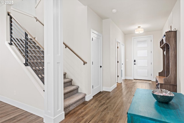 foyer entrance with dark hardwood / wood-style flooring