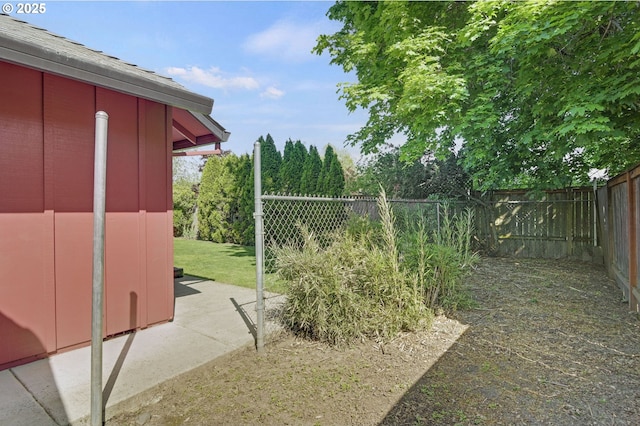 view of yard with a fenced backyard and a patio area