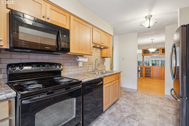 1200 NE Territorial Rd Unit 83, Canby, OR 97013 - kitchen with black appliances, a sink, light brown cabinetry, decorative backsplash, and light stone countertops