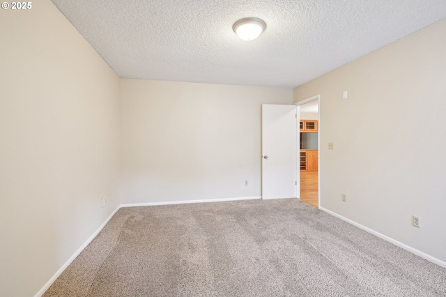1200 NE Territorial Rd Unit 83, Canby, OR 97013 - unfurnished room featuring a textured ceiling, carpet, and baseboards