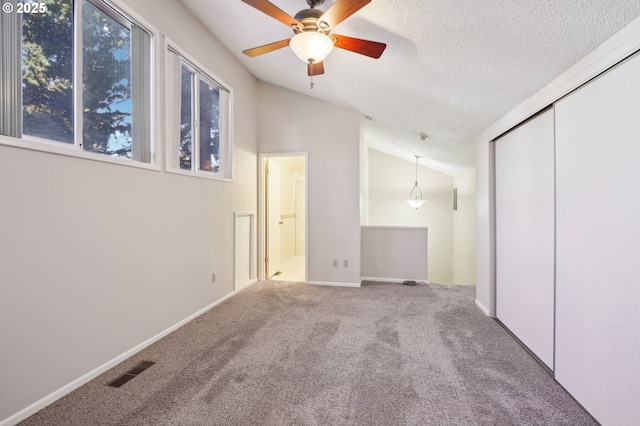 1200 NE Territorial Rd Unit 83, Canby, OR 97013 - unfurnished bedroom featuring lofted ceiling, carpet floors, a closet, a textured ceiling, and ensuite bath