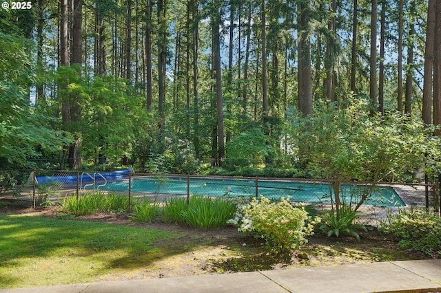 1200 NE Territorial Rd Unit 83, Canby, OR 97013 - view of tennis court featuring a wooded view