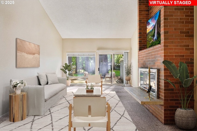 1200 NE Territorial Rd Unit 83, Canby, OR 97013 - living area with lofted ceiling, a brick fireplace, carpet floors, and a textured ceiling