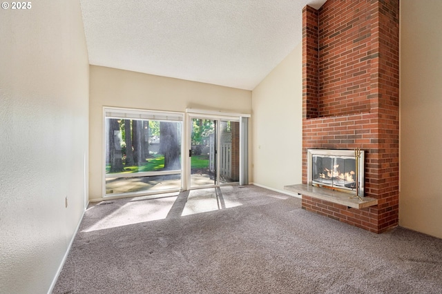 1200 NE Territorial Rd Unit 83, Canby, OR 97013 - unfurnished living room featuring carpet, a brick fireplace, lofted ceiling, and a textured ceiling