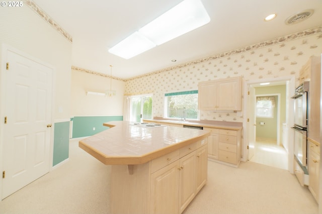 4020 NW Princess St, Corvallis, OR 97330 - kitchen featuring tile countertops, double oven, light colored carpet, a center island, and recessed lighting