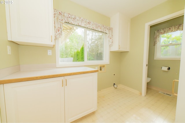 4020 NW Princess St, Corvallis, OR 97330 - washroom featuring hookup for an electric dryer, cabinet space, washer hookup, and light floors