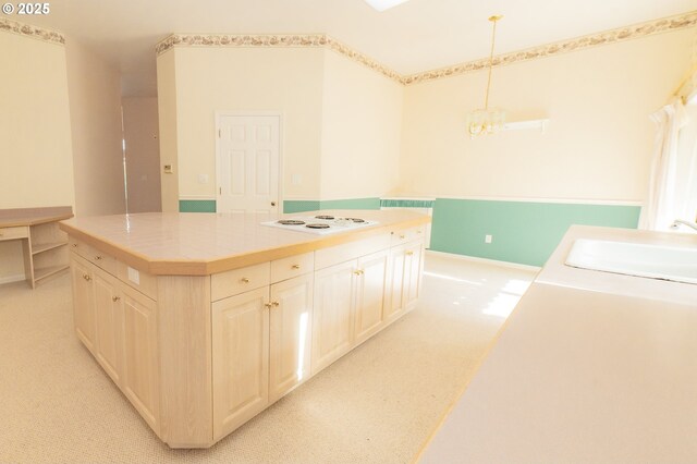 4020 NW Princess St, Corvallis, OR 97330 - kitchen with white electric stovetop, a center island, light carpet, a chandelier, and hanging light fixtures