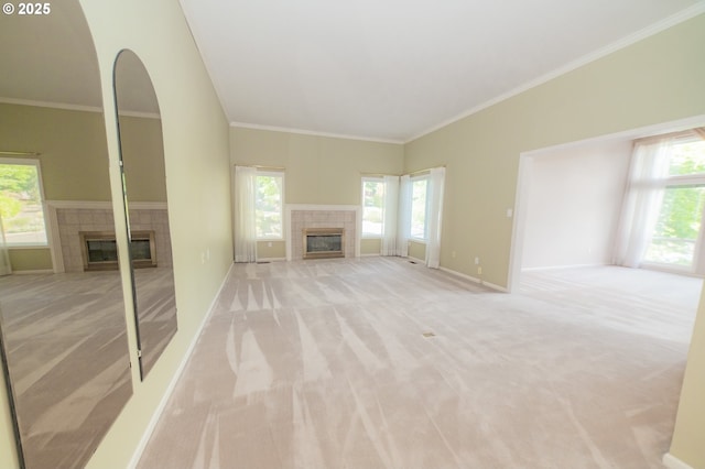 4020 NW Princess St, Corvallis, OR 97330 - unfurnished living room featuring a fireplace, light carpet, plenty of natural light, and crown molding
