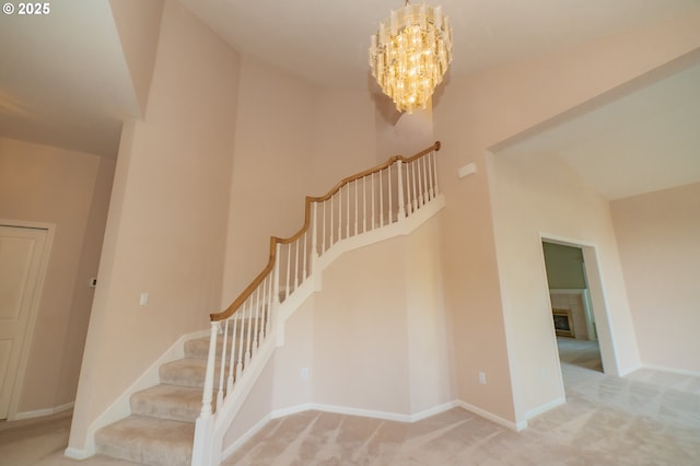 4020 NW Princess St, Corvallis, OR 97330 - staircase featuring carpet, a chandelier, and a tile fireplace