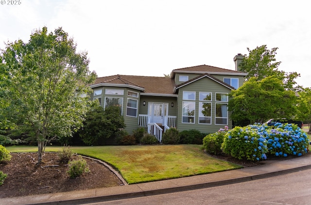 4020 NW Princess St, Corvallis, OR 97330 - view of front of property with a front lawn and a chimney