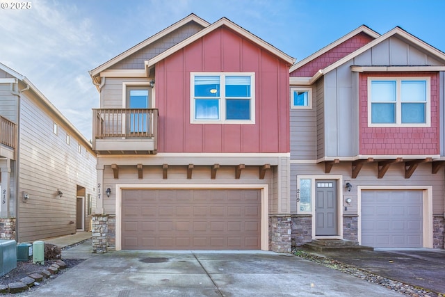 craftsman-style house featuring a balcony and a garage