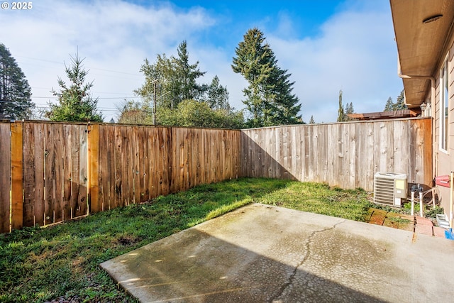 view of yard featuring a patio and central AC unit