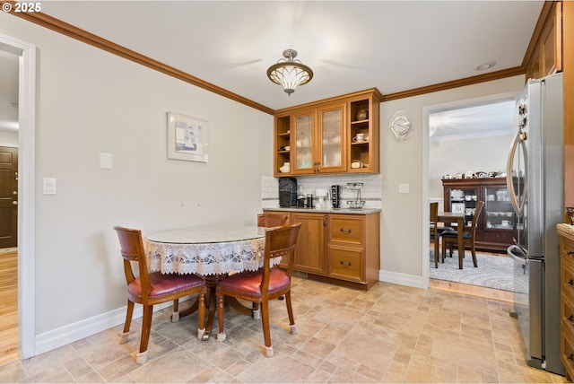 dining room with crown molding