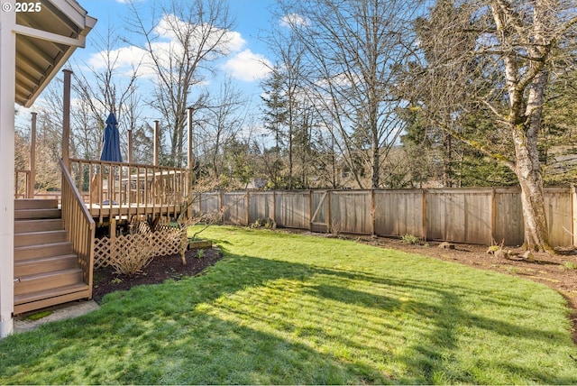 view of yard featuring a wooden deck