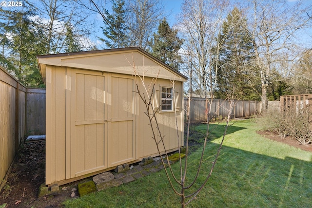 view of outbuilding featuring a lawn