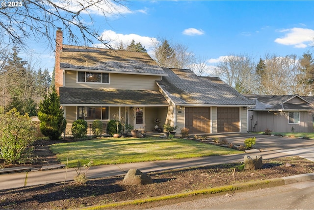 view of front facade featuring a garage and a front yard