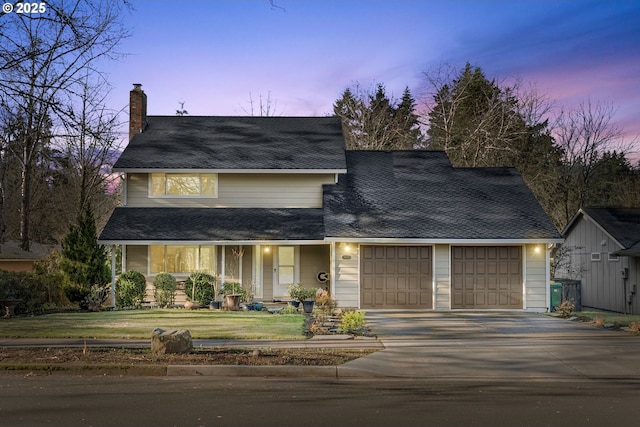 view of front of home with a lawn, a porch, and a garage