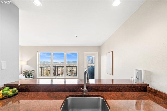 310 NW Uptown Ter Unit 1A, Portland, OR 97210 - kitchen with recessed lighting and dark stone countertops