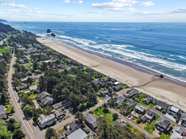 aerial view with a water view, a view of the beach, and a residential view
