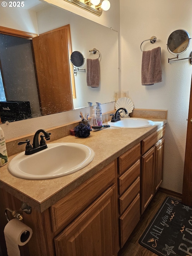 510 NE Yamhill St, Sheridan, OR 97378 - full bath with wood finished floors, a sink, and double vanity