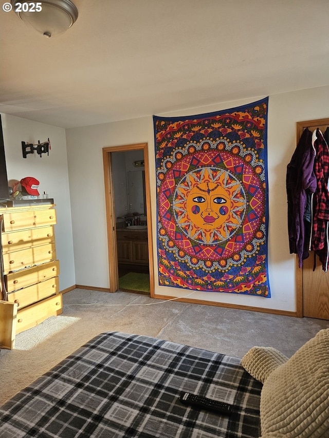 510 NE Yamhill St, Sheridan, OR 97378 - carpeted bedroom with ensuite bath, baseboards, and a sink
