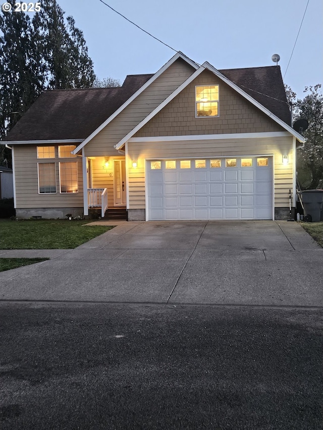 510 NE Yamhill St, Sheridan, OR 97378 - view of front facade featuring a garage and concrete driveway