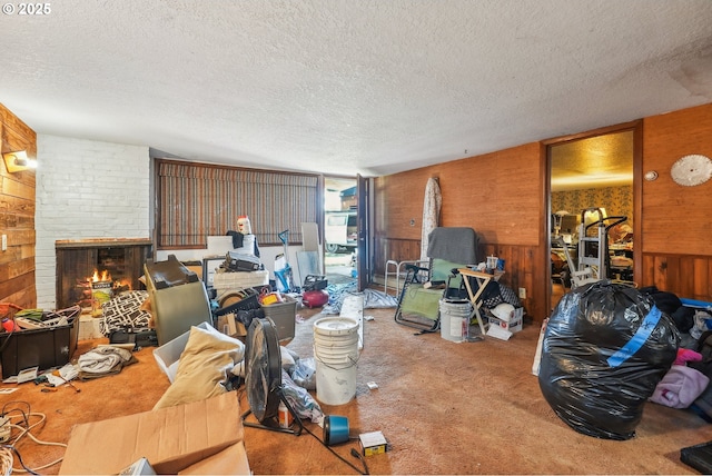 6395 SW 190th Ave, Beaverton, OR 97078 - living area with wood walls, carpet flooring, a textured ceiling, and a fireplace