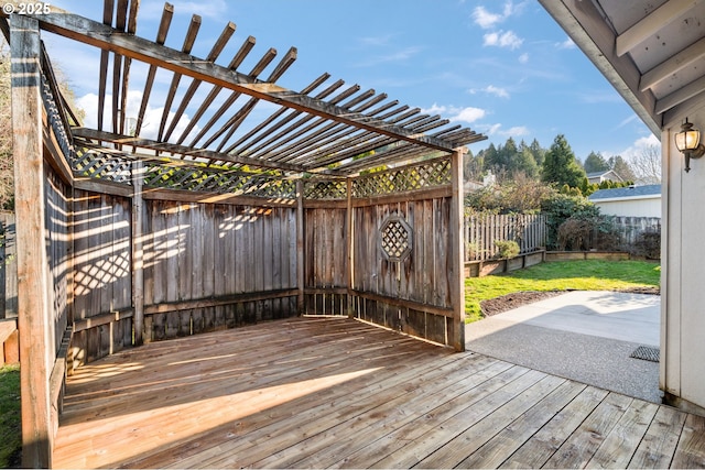 deck with a yard, a patio area, a fenced backyard, and a pergola