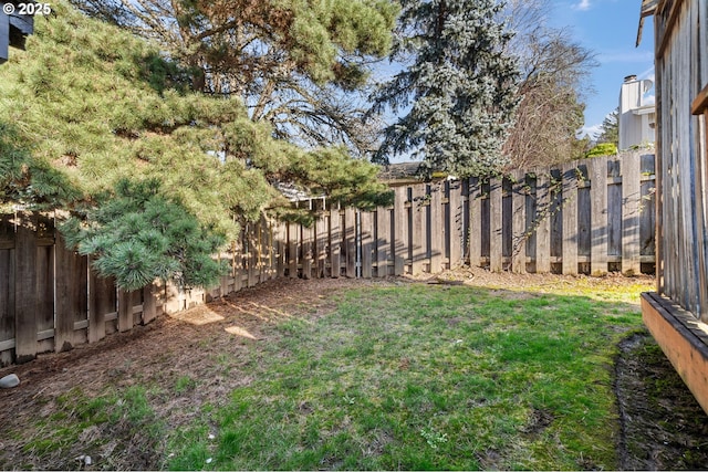 view of yard with a fenced backyard