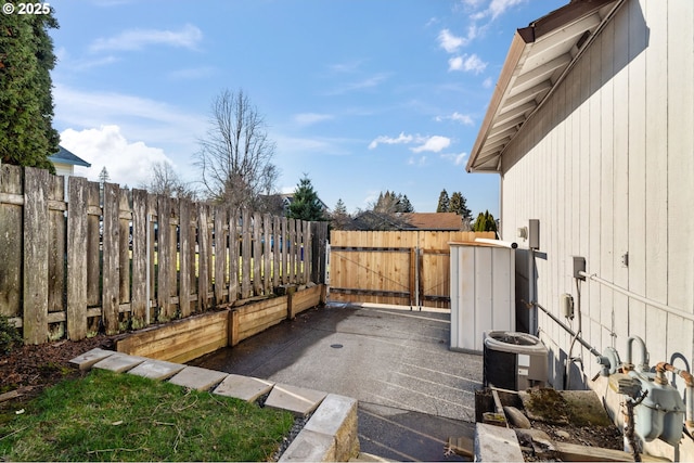 view of patio / terrace featuring fence, a gate, and central air condition unit