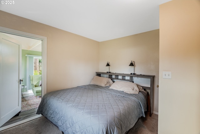 carpeted bedroom featuring baseboards