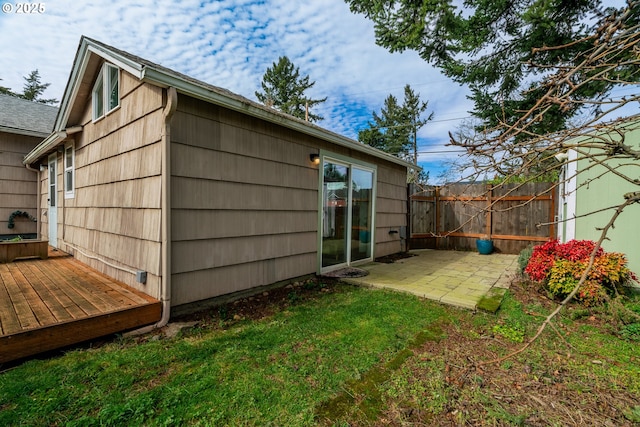 view of outbuilding featuring fence