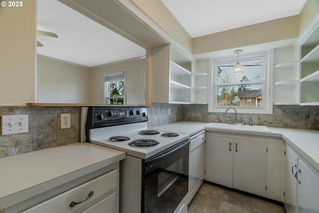 kitchen featuring white dishwasher, range with electric stovetop, a sink, and open shelves