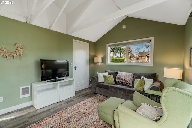 living area with lofted ceiling, visible vents, baseboards, and wood finished floors