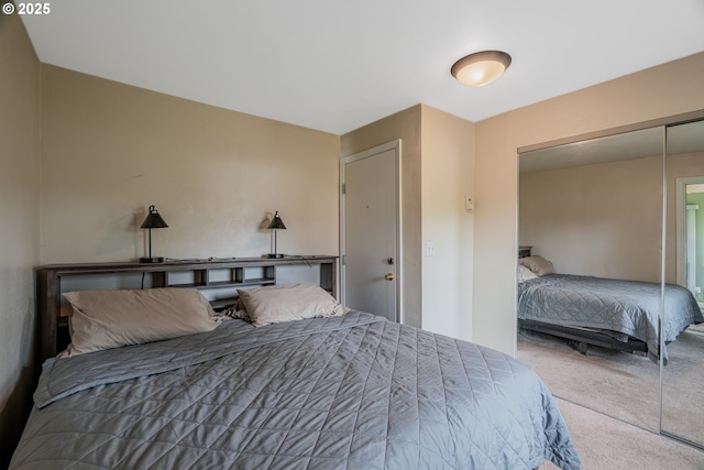 bedroom with a closet and carpet