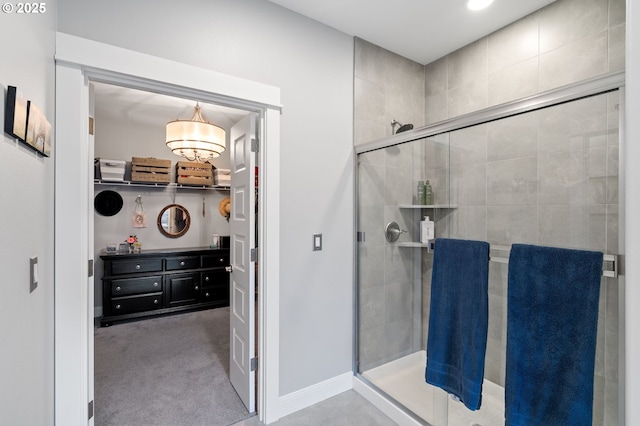 10603 NE 92nd Ave, Vancouver, WA 98662 - bathroom with a stall shower, a chandelier, and baseboards