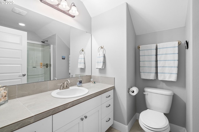 10603 NE 92nd Ave, Vancouver, WA 98662 - bathroom featuring vaulted ceiling, a stall shower, vanity, toilet, and baseboards