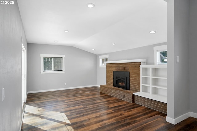 220 Adams Ave, Silverton, OR 97381 - unfurnished living room featuring wood finished floors, baseboards, lofted ceiling, a fireplace, and recessed lighting