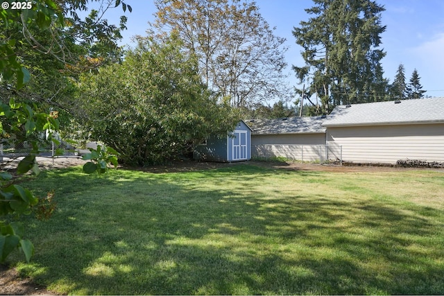 220 Adams Ave, Silverton, OR 97381 - view of grassy yard with a storage unit and an outdoor structure