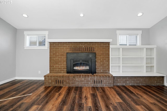 220 Adams Ave, Silverton, OR 97381 - unfurnished living room featuring wood finished floors, baseboards, a fireplace, and recessed lighting