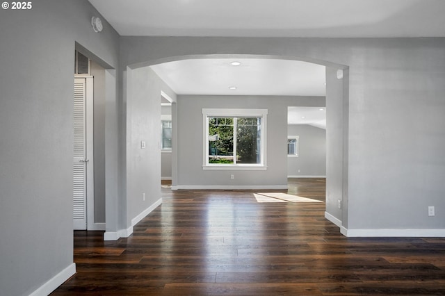220 Adams Ave, Silverton, OR 97381 - unfurnished room with arched walkways, wood finished floors, baseboards, and recessed lighting