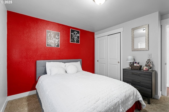 carpeted bedroom with a closet