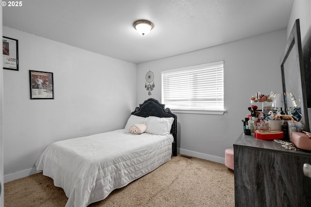 bedroom with light colored carpet