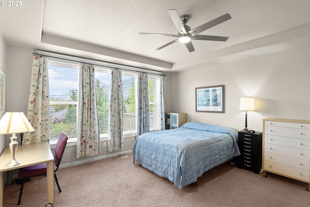 bedroom with baseboards, multiple windows, carpet flooring, and ceiling fan