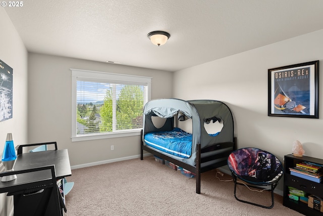 carpeted bedroom with baseboards and visible vents