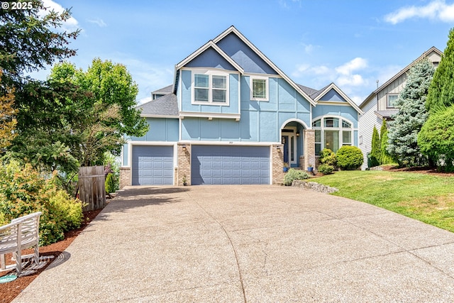 view of front of property with board and batten siding, a garage, brick siding, fence, and concrete driveway